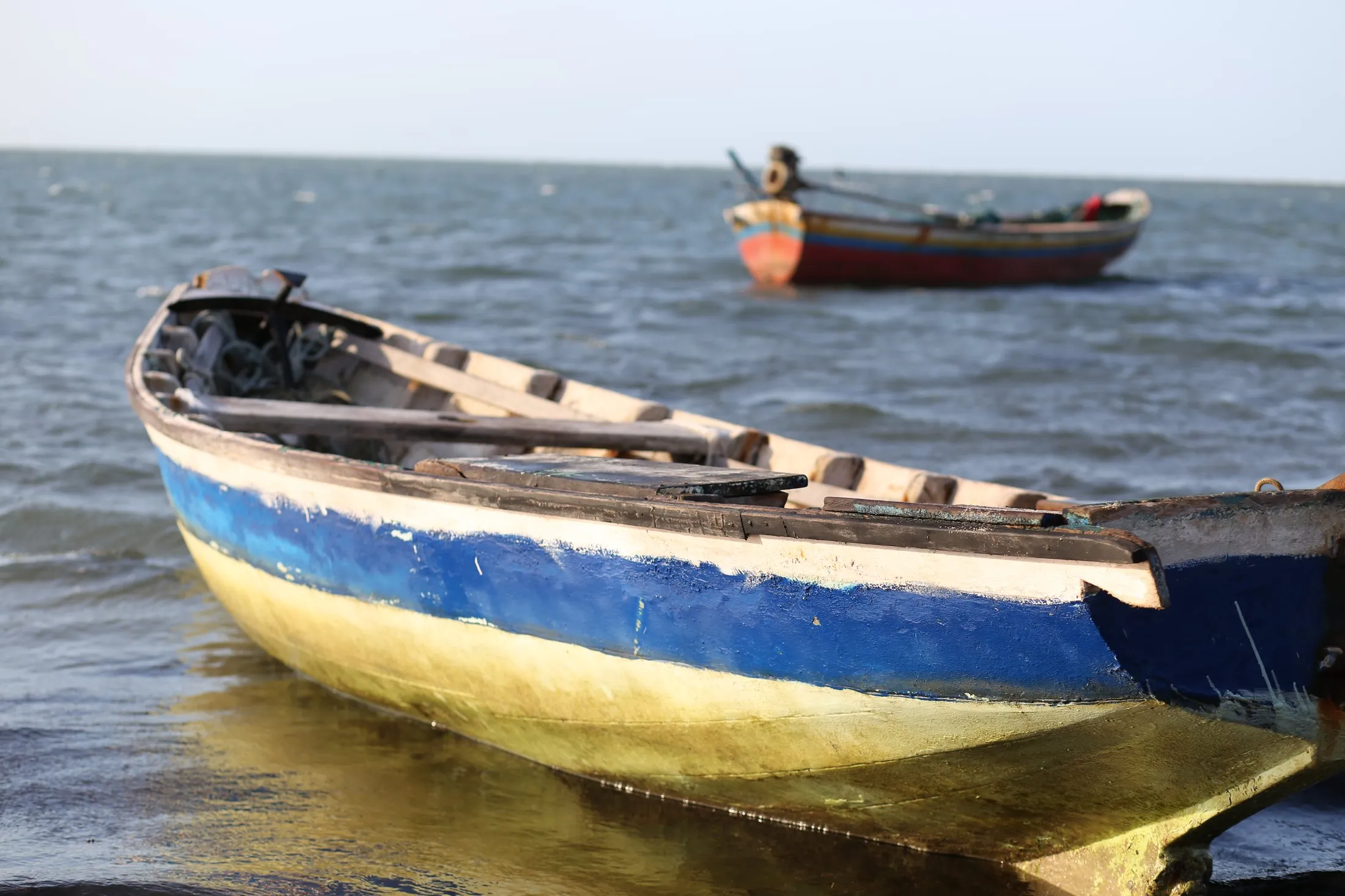 Os barcos de pescador, na praia